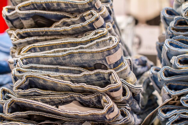 Stack of folded jeans in the store