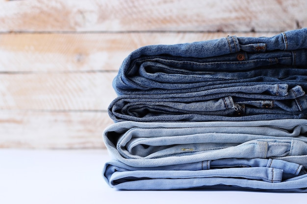 Stack of folded jeans on the table