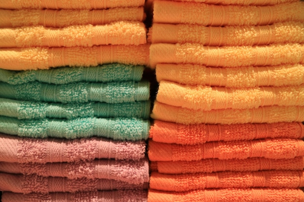 Stack of folded vibrant color bath towels, Texture, Background