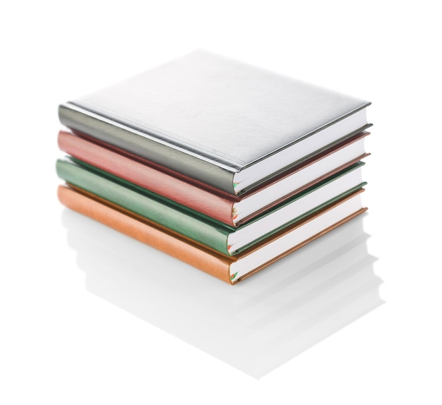 Stack of four diaries isolated