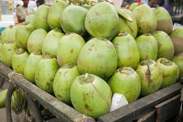 Stack of fresh coconut display for sale