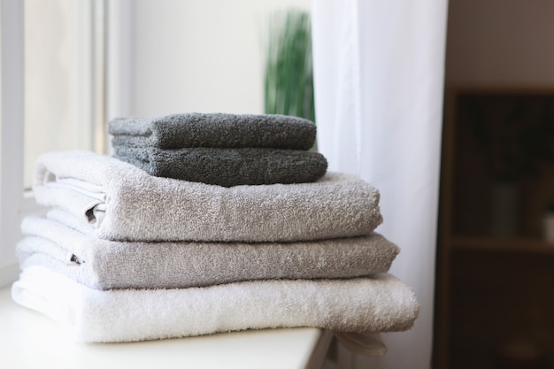 A stack of fresh towels on the table