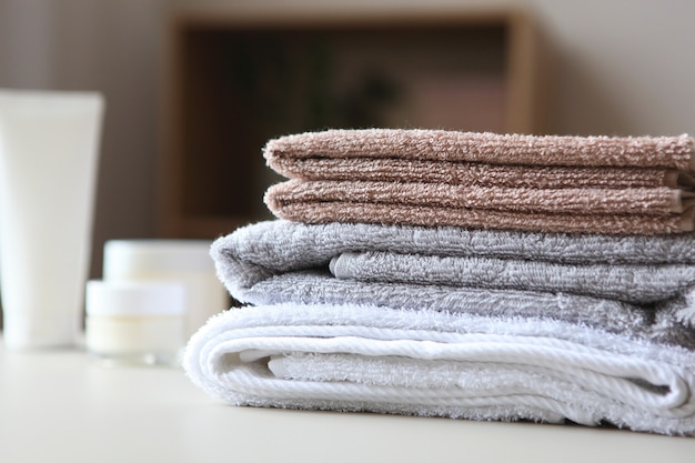 A stack of fresh towels on the table