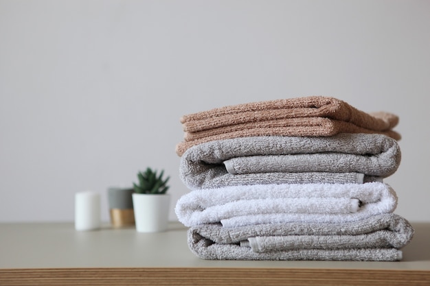 A stack of fresh towels on the table