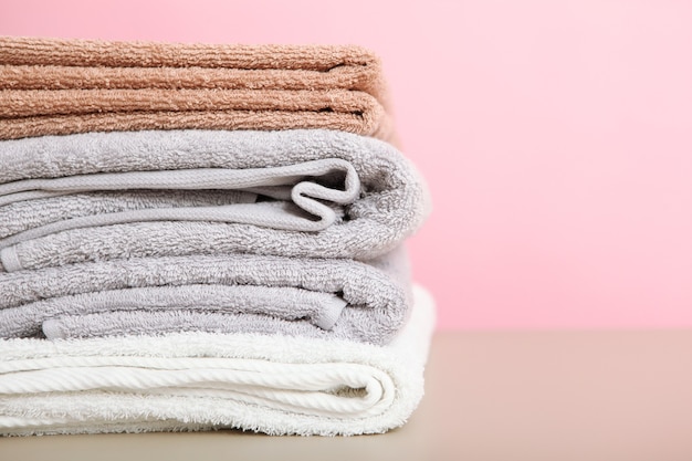 A stack of fresh towels on the table