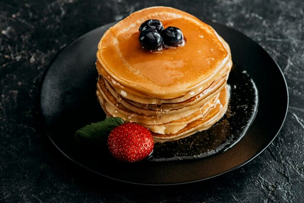 stack freshly backed pancakes berries