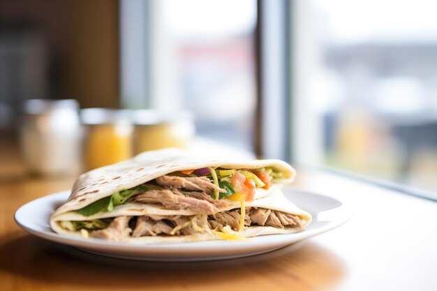 Stack of freshly baked pita bread next to shawarma meat