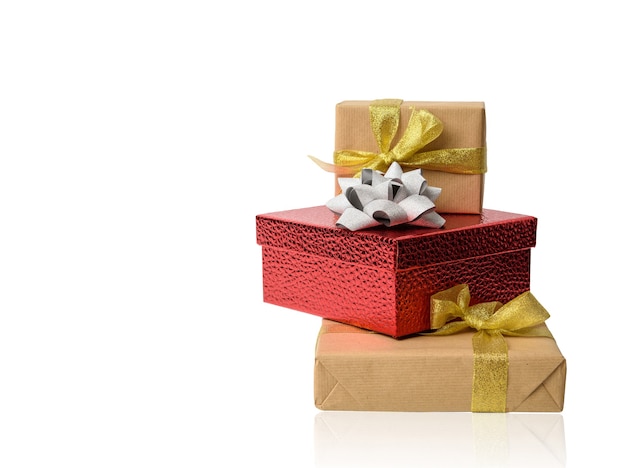 Stack of gifts wrapped in brown kraft paper and tied with silk ribbon, boxes isolated on white background, element for designer