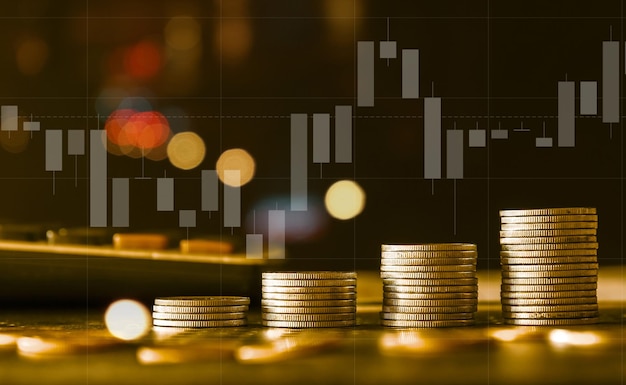 Stack of gold money coin with trading graph financial investment concept can be use as background