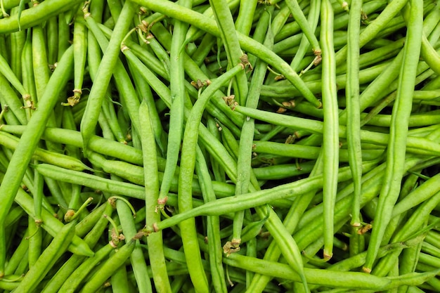 Stack of green beans in a market stall