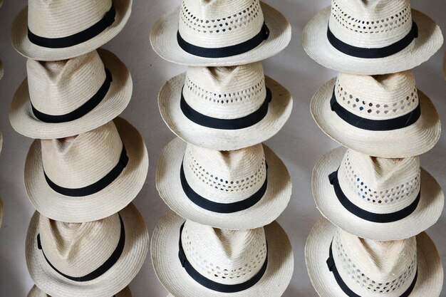 Photo stack of hats for sale at market stall