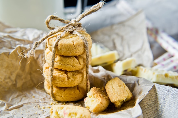 A stack of homemade shortbread, a glass of milk. 