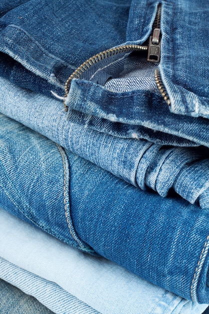 Stack of jeans in different colors