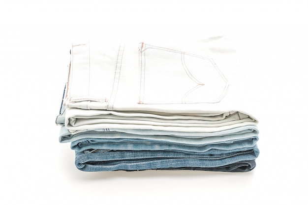 Photo stack of jeans folded on white background