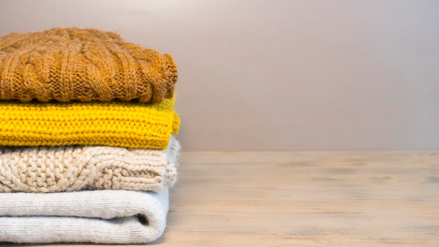 Stack of jersey in beige and mustard color scheme