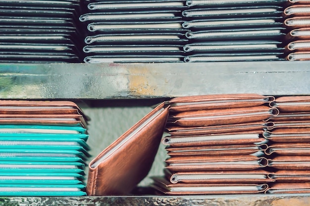 Stack of menus lying on wooden background.