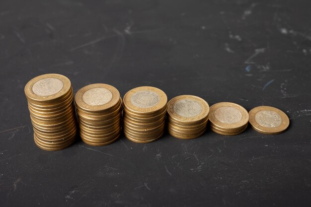 stack of mexican peso coins on the table