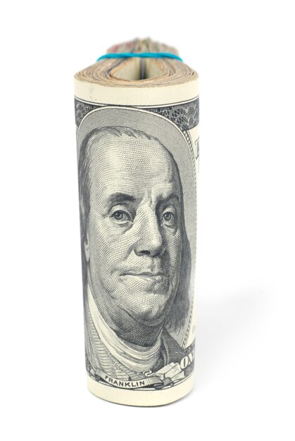 Stack of money cash of US dollars with Benjamin Franklin isolated