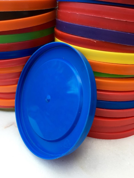 Photo stack of multi colored plastic lids