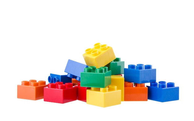 stack of multi colored toy blocks on white background