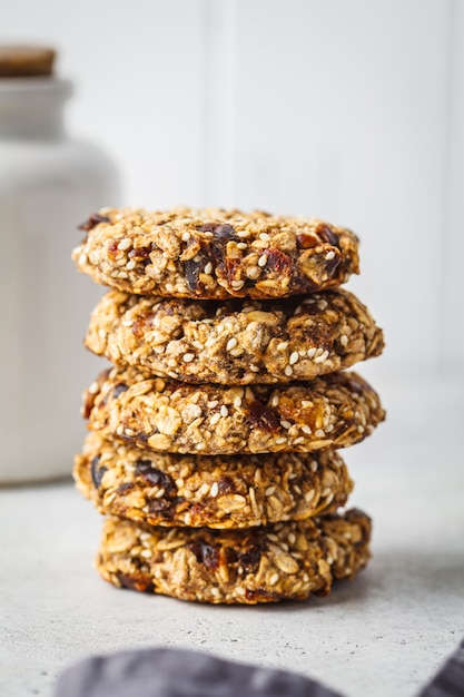 Stack of oatmeal cookies with dates. Healthy dessert concept.