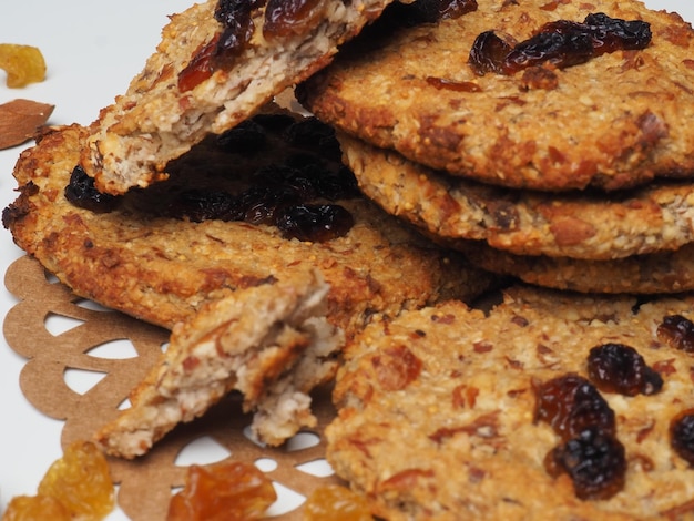 A stack of oatmeal cookies with raisins on top