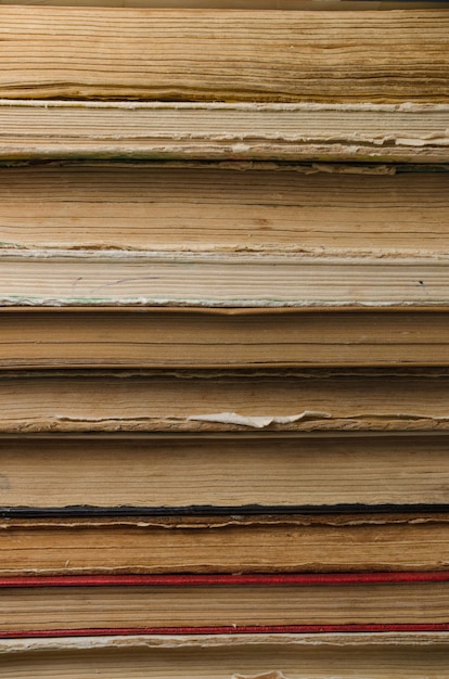 Stack of old books closeup, shabby paper