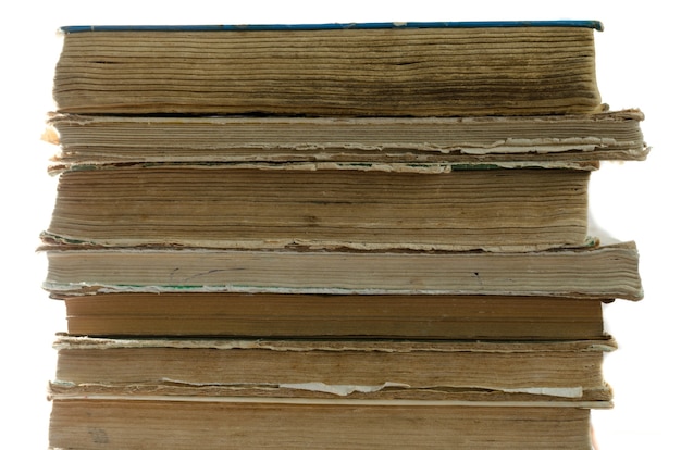 A stack of old books on white background