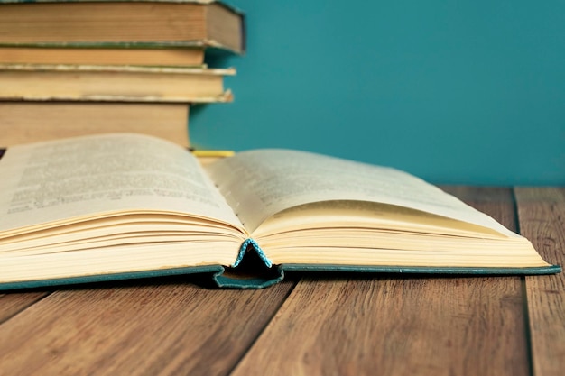 A stack of old books with yellow pages Book binding Knowledge and education