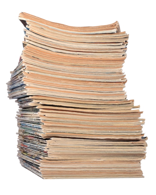 Stack of old magazines on a white background