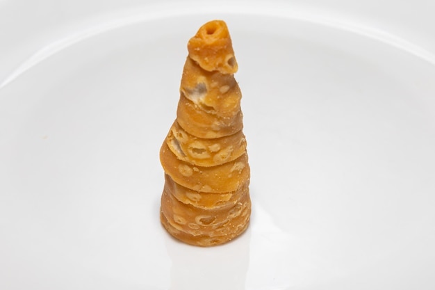 A stack of orange candy stacked on top of each other.