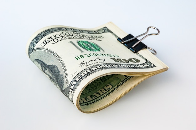 a stack of packaged dollars on a white background