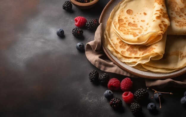 A stack of pancakes with berries on a dark background