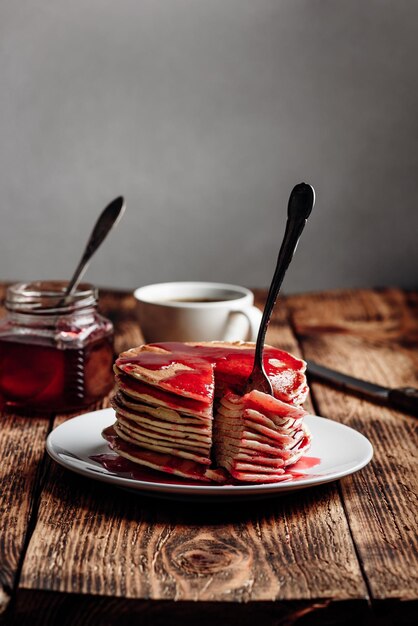 Stack of pancakes with berry fruit marmalade