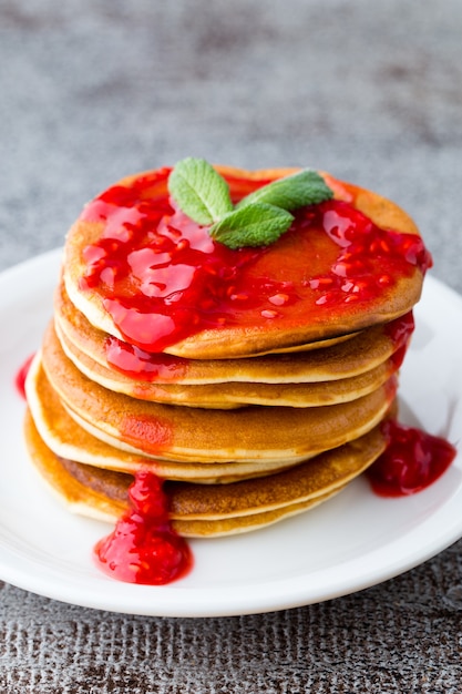 Stack of pancakes with fresh berry.