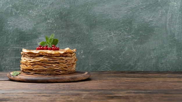 Stack of pancakes on a wooden table