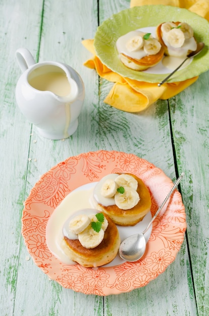 A stack of pancakes on a wooden table