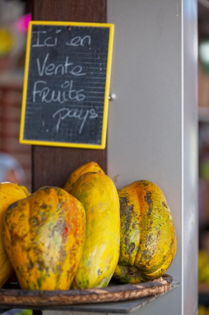 Stack of papayas on a market stall