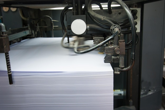 Photo stack of paper in machinery at factory