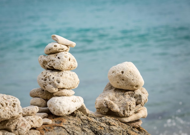 Photo stack of pebbles by ocean seaside