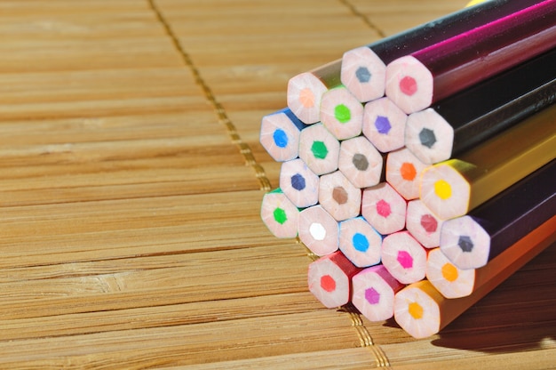 Stack of pencils on wooden table