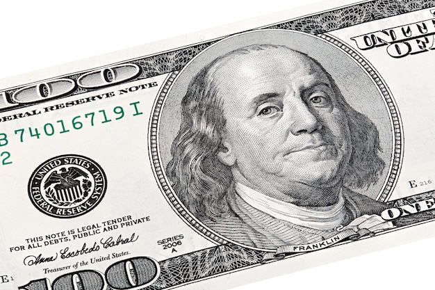 Stack photo of Benjamin Franklin, Federal Reserve System print on one hundred dollars bill.