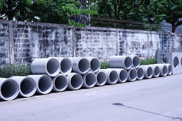 Stack of pipes against wall