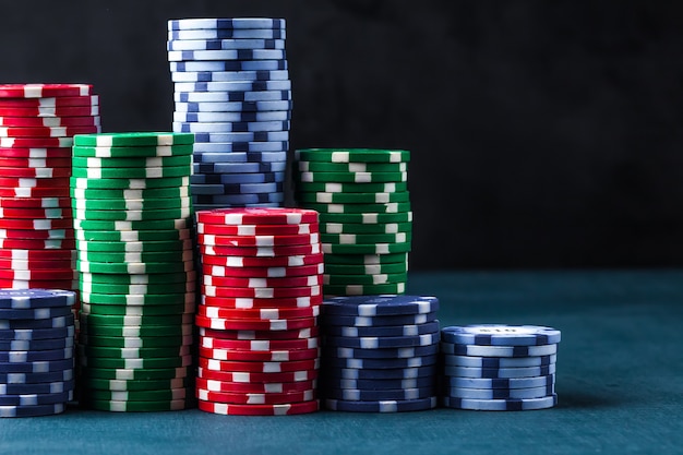 Stack of poker chips on a blue table