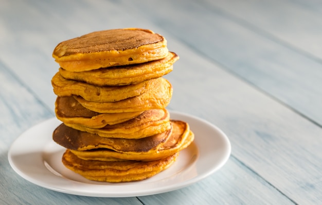 Stack of pumpkin pancakes on the plate