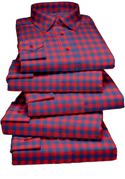 A stack of red and blue plaid shirts with the word 