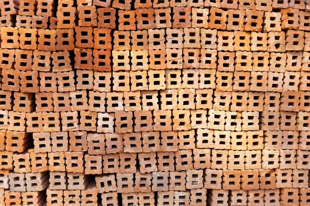 Stack of red bricks orange clay bricks