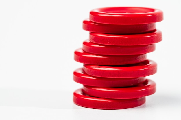 Stack of red buttons on white background