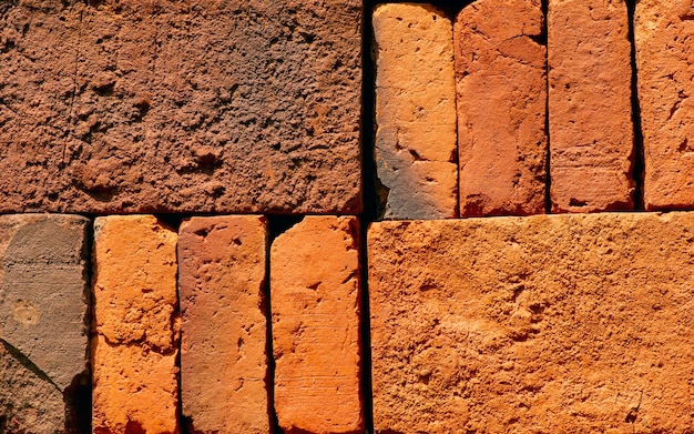 Stack of red clay bricks, building materials