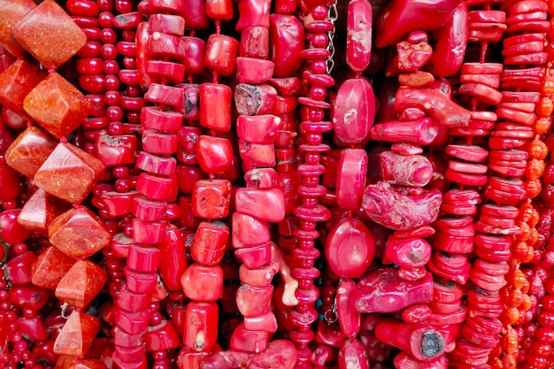 Stack of red coral necklaces for sale